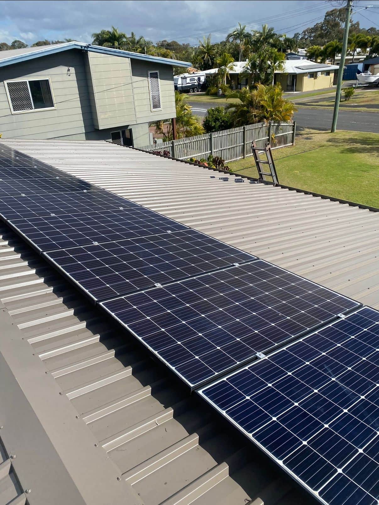 Metal roof with solar panels. The roof was clean and painted.